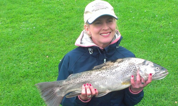 Natalie Hanson with the trout she caught on her first fishing trip