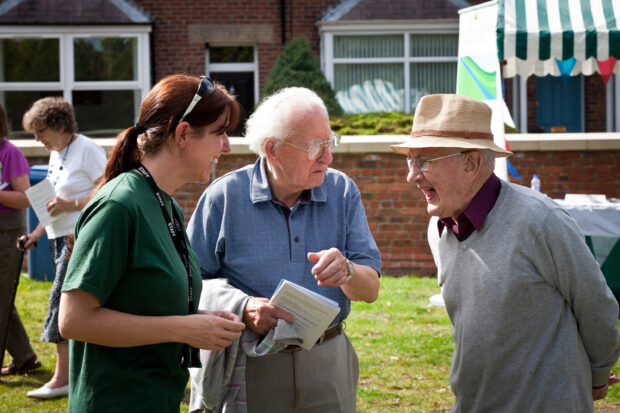 Local residents speaking with a member of are Environmental Analysis team. 