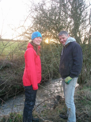 Rosie Law from West Cumbria Rivers Trust discussing fencing options with Mr Harrison, a local farmer