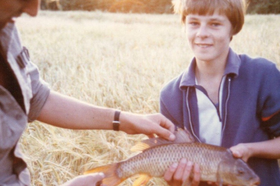 Nick the Door Knocker aged 12 with John Bailey and a wild Carp