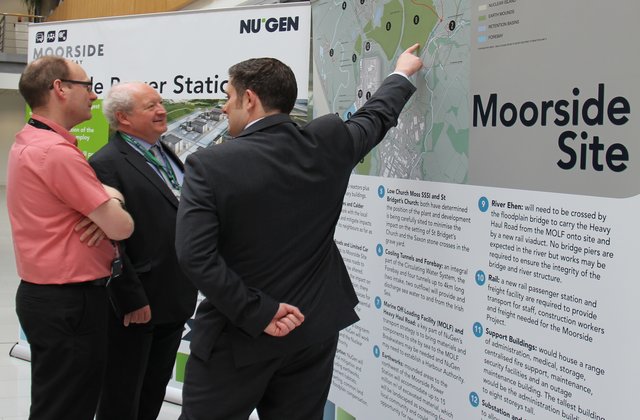 Man points to a map of the Moorside site in West Cumbria