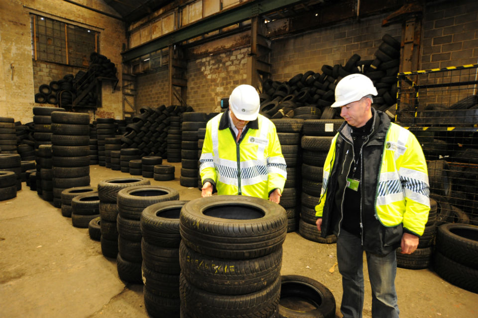 Environment Officers inspect waste tyres