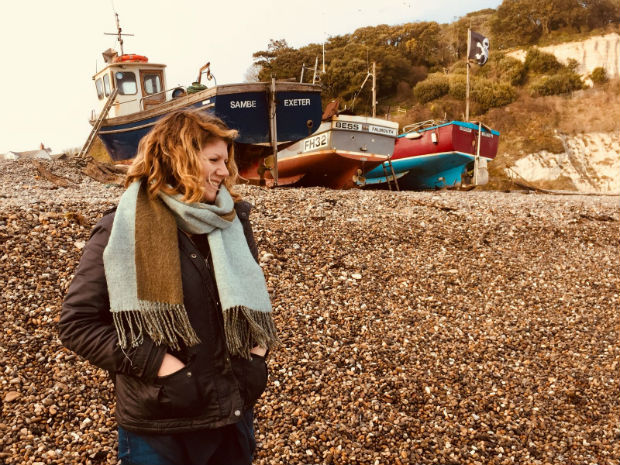 Charlie standing on a beach 