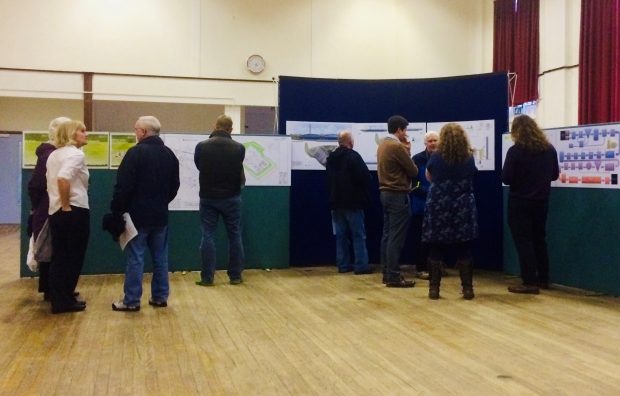 A group of people attend a public consultation