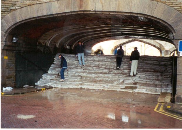 Sandbags piled up against the Lendal Bridge arch floodgate during the 2000 flooding in York