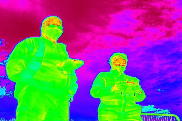 Thermal image of two drone pilots