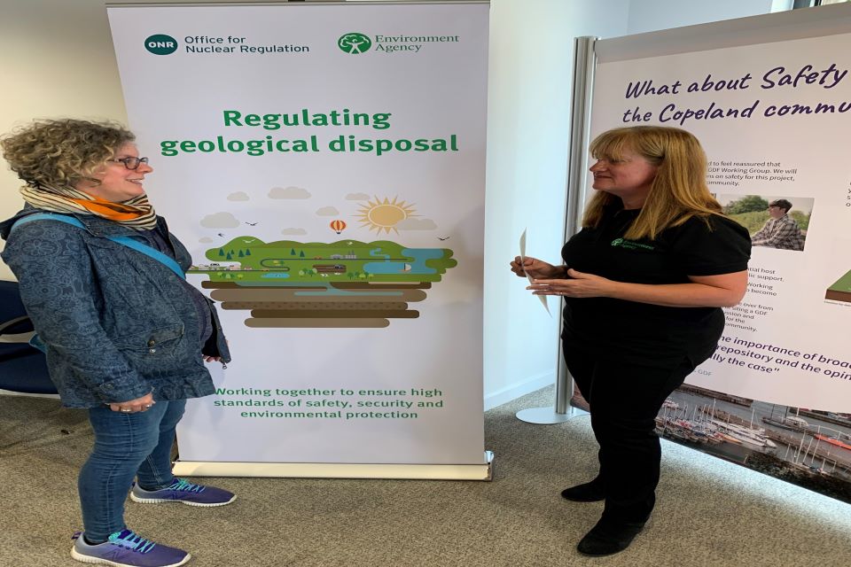 Candida Lean answers questions about regulating geological at a public exhibition