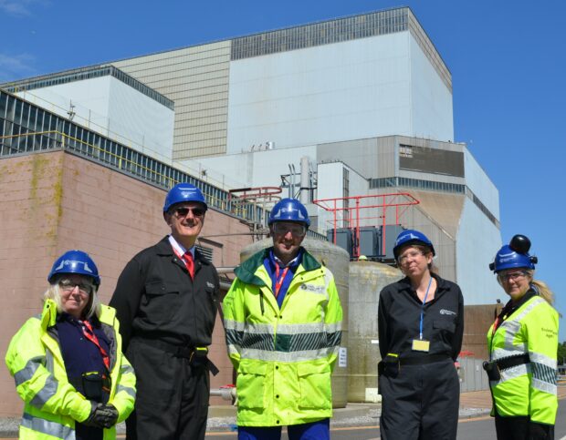 Hinkley regulation team in front of the HPB reactor building 