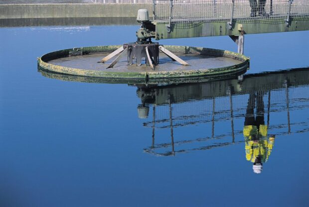 Reflection of man at wastewater treatment works