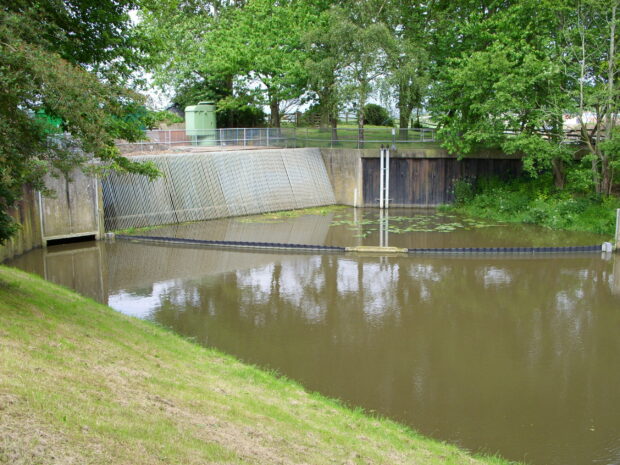 Beddingham gravity bypass sluice (left) with weed screen (centre) and level controller sensors (right side wall)