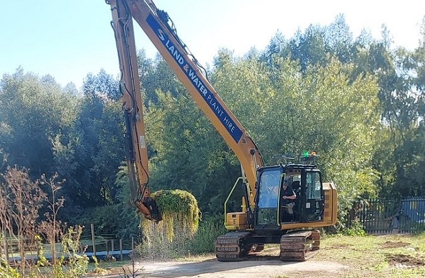 Clump of weeds being lifted