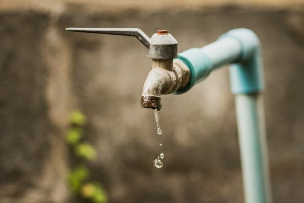 Tap dripping with water