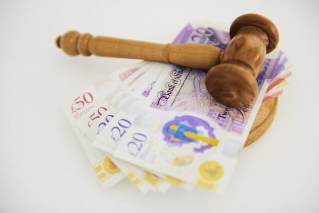 British currency on gavel
