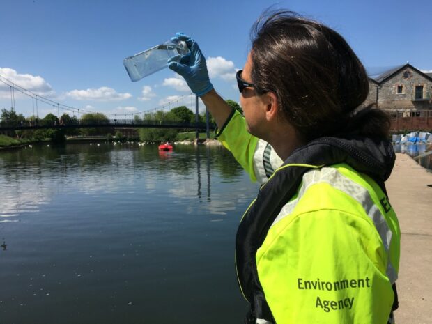 Water sampling on the river Exe at Exeter Quay, Devon