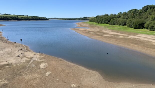 The photograph captured in August 2022 shows low water levels in the Roadford Reservoir in Devon during the 2022 drought. 