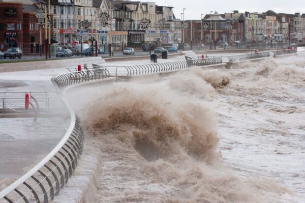 Waves crashing against a sea wall.