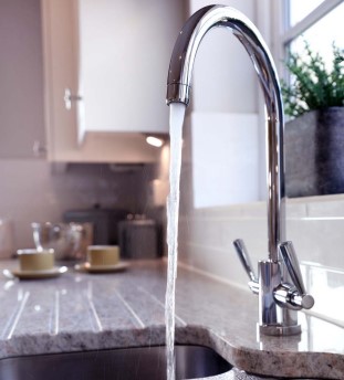 Image of a kitchen tap running