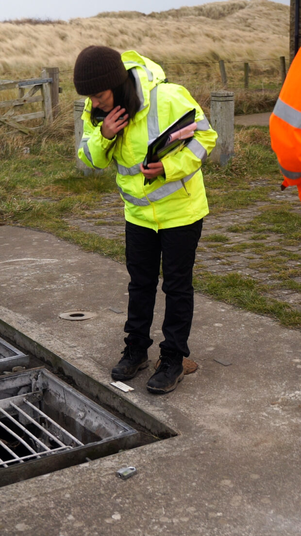 An EA inspector looking at water company assets.