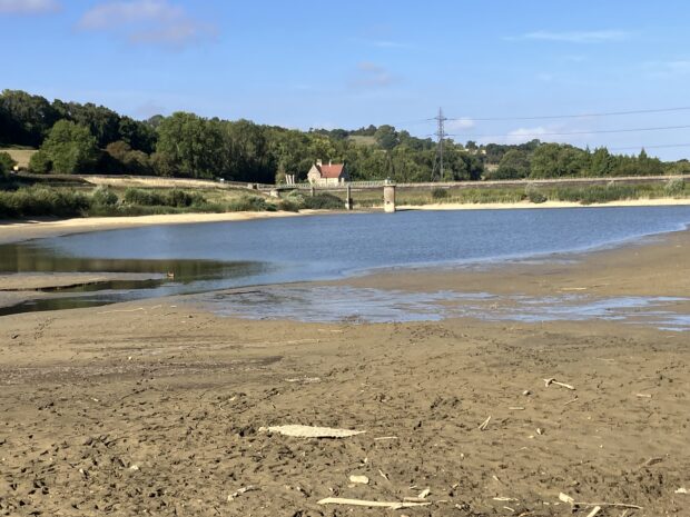 Dowdeswell reservoir in Gloucestershire showing the low water level.