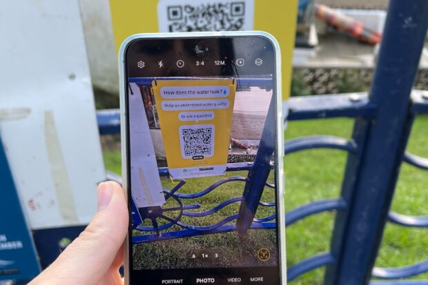 A QR code as seen on the screen of a smart phone's camera function. 