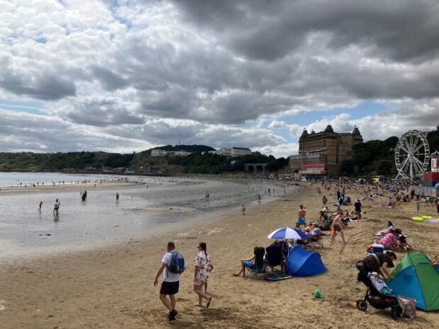 People looking out over Scarborough South Bay and beach