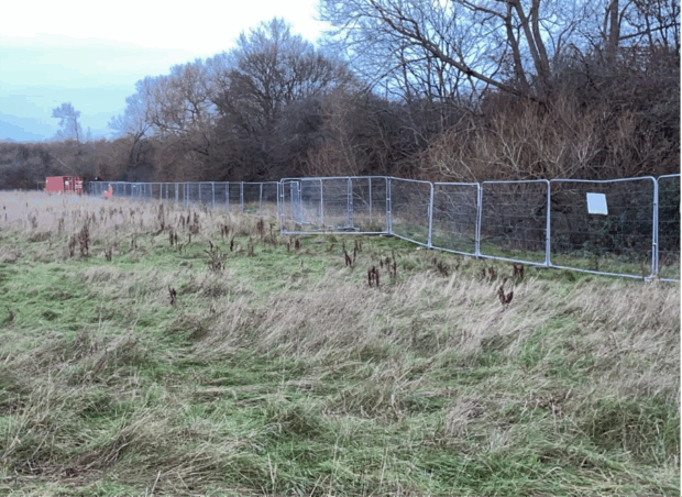 Heras fencing around the Kidlington illegal waste site. 