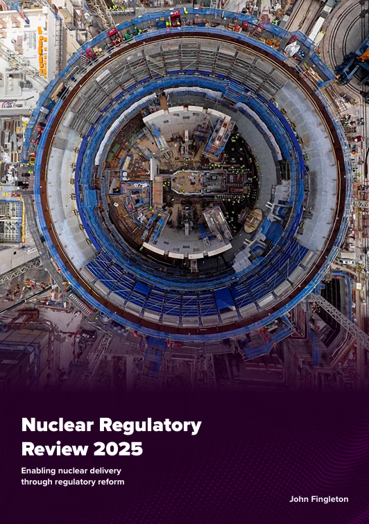 Cover of the Nuclear Regulatory Review 2025, featuring an overhead photograph of a large circular nuclear construction site.